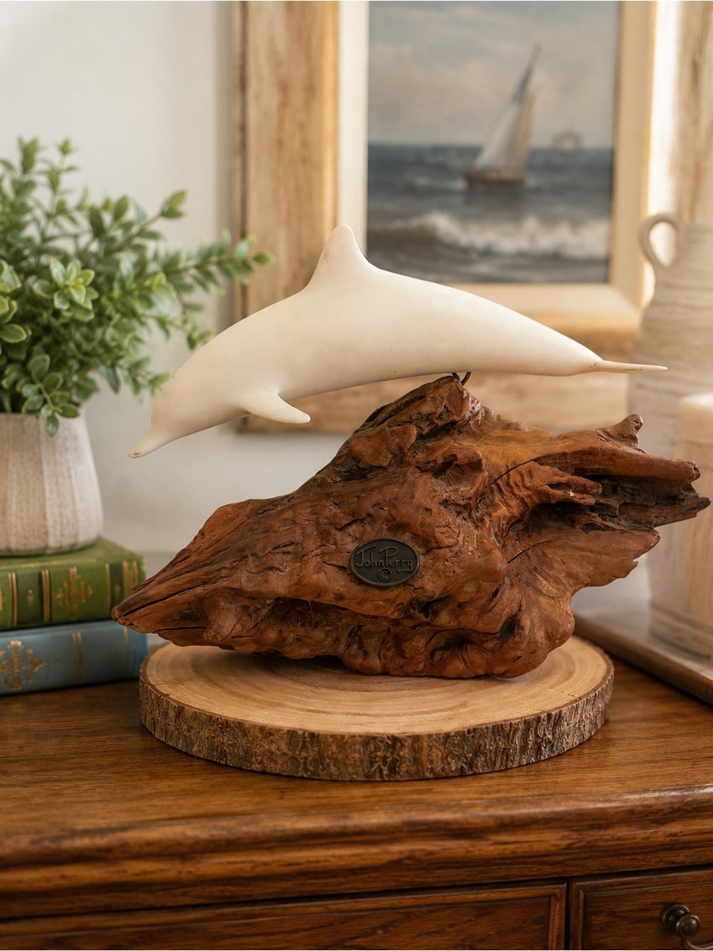 White Dolphin Sculpture on Sculpted Wood Base by John Perry